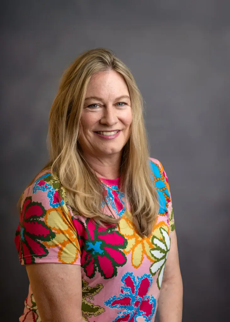 Blonde woman against gray background