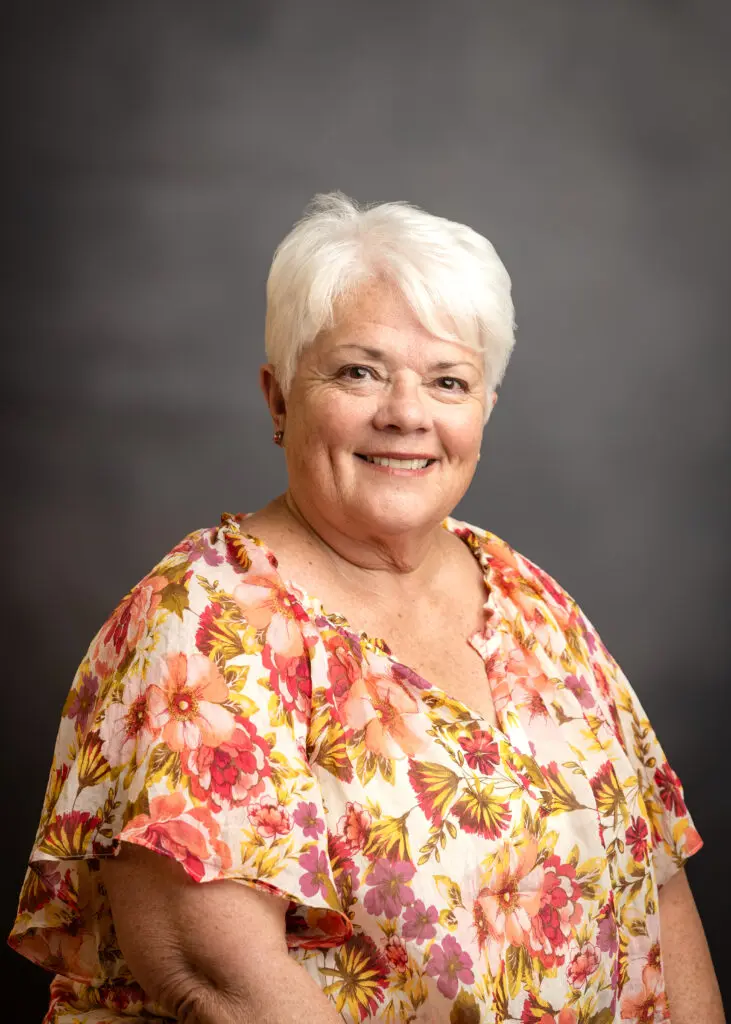 Happy older woman with floral top