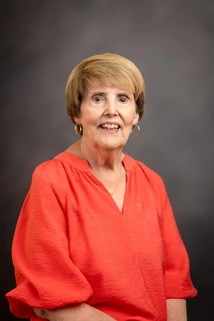 Woman in red shirt smiling