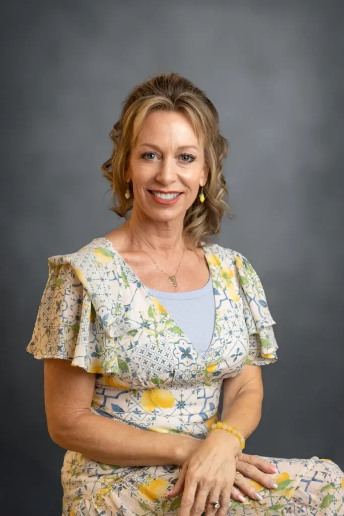 Woman posing against gray background