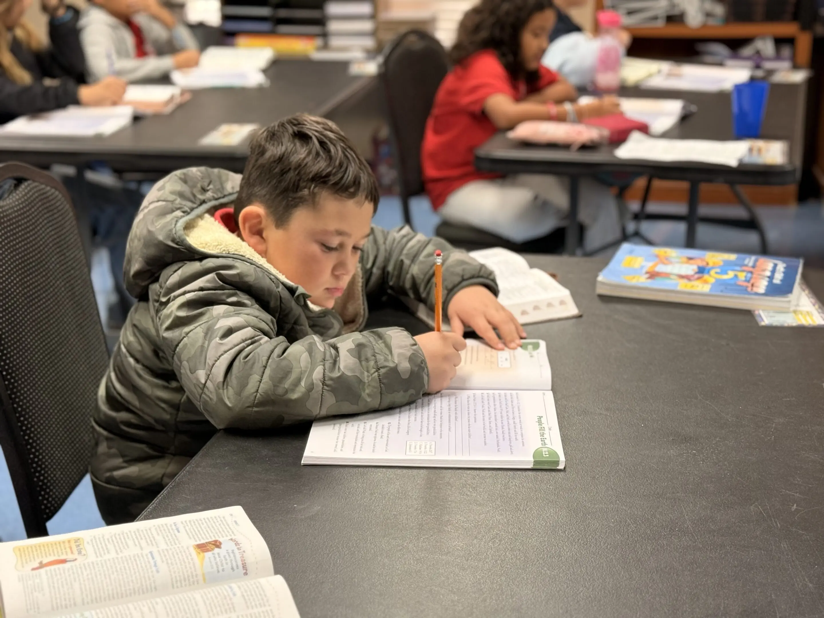 Child focused on classroom assignment