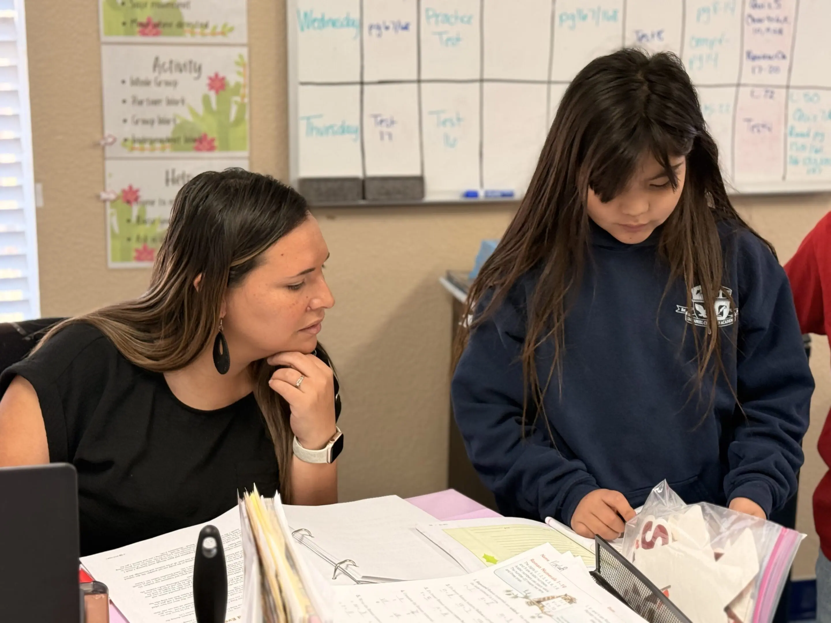 Classroom discussion between teacher and student