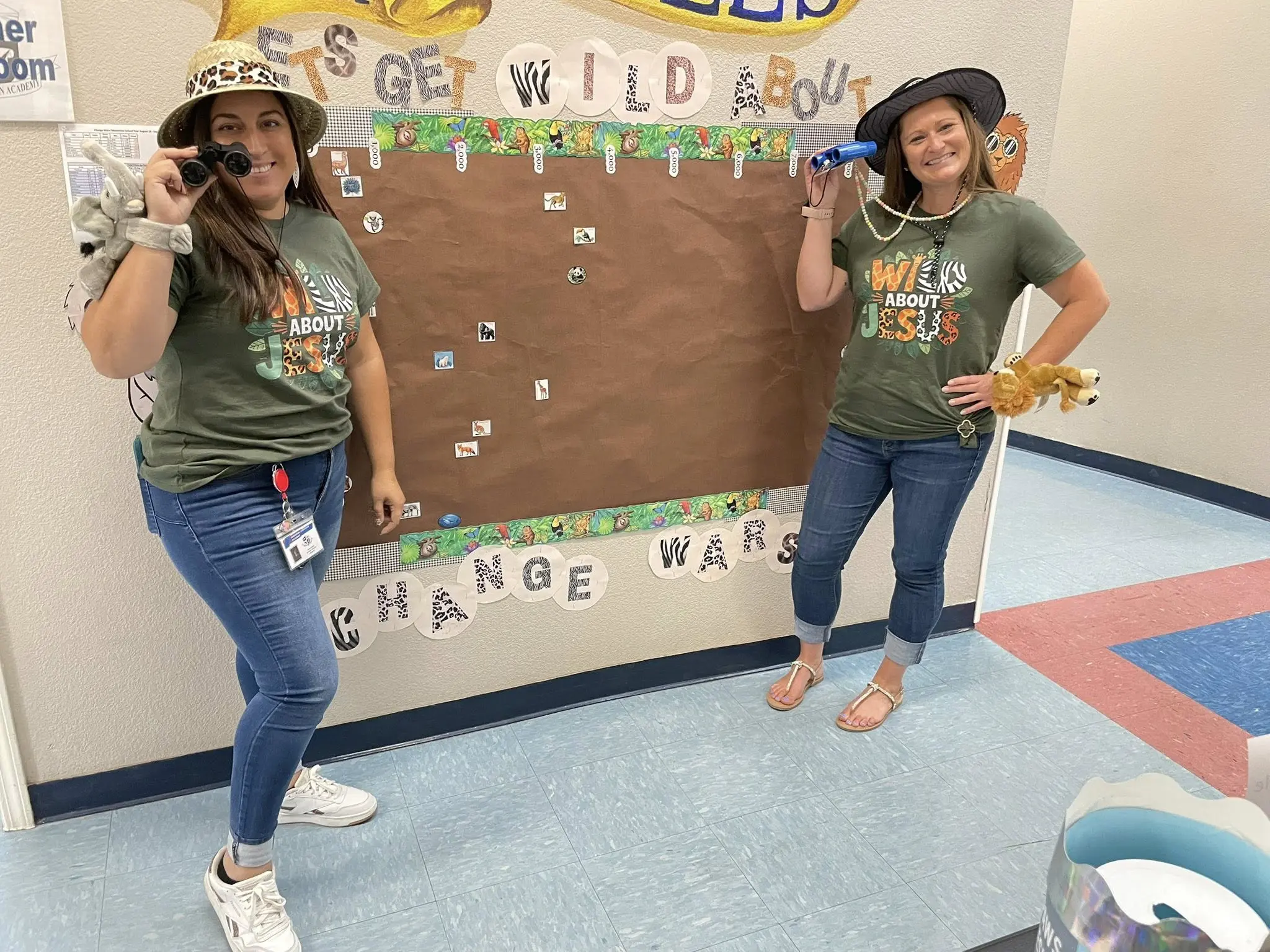 Women in safari hats near bulletin board